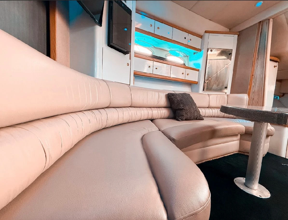 Salon interior with leather seating and TV